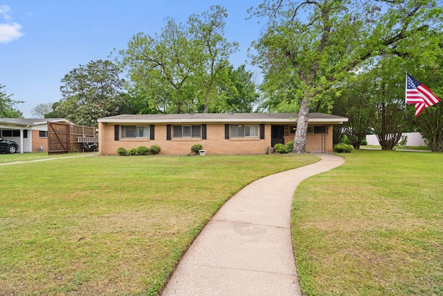 717 Van Horn Dr, Irving, TX 75060 - ranch-style home featuring brick siding and a front yard