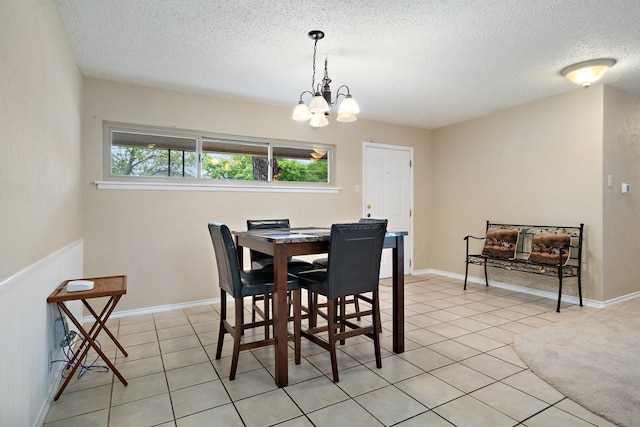 717 Van Horn Dr, Irving, TX 75060 - dining room featuring a chandelier, a textured ceiling, and light tile patterned floors
