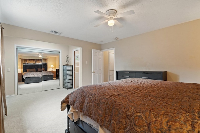 717 Van Horn Dr, Irving, TX 75060 - bedroom with a textured ceiling, a closet, ceiling fan, carpet flooring, and visible vents