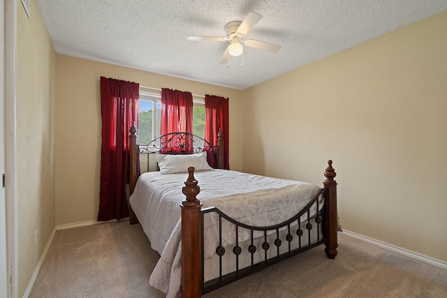 717 Van Horn Dr, Irving, TX 75060 - carpeted bedroom featuring baseboards, a ceiling fan, and a textured ceiling