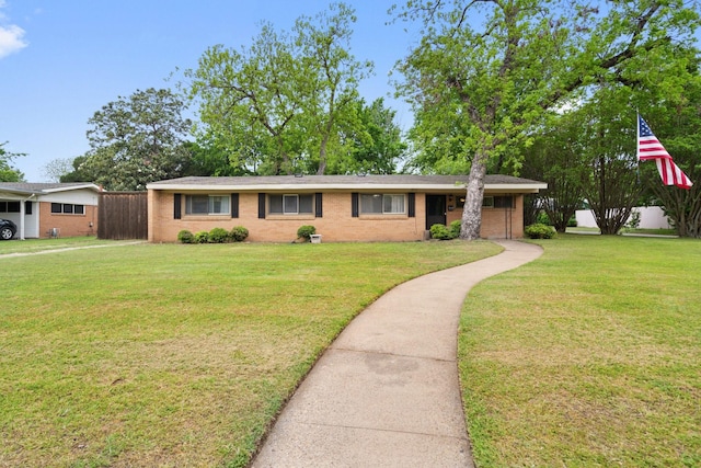 717 Van Horn Dr, Irving, TX 75060 - ranch-style house with brick siding, a front yard, and fence