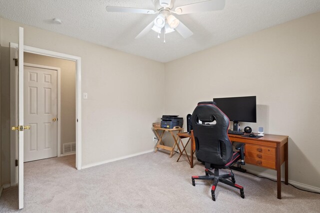717 Van Horn Dr, Irving, TX 75060 - office area with a textured ceiling, ceiling fan, baseboards, carpet flooring, and visible vents