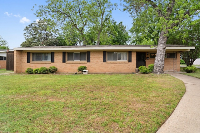 717 Van Horn Dr, Irving, TX 75060 - ranch-style home featuring a front lawn and brick siding