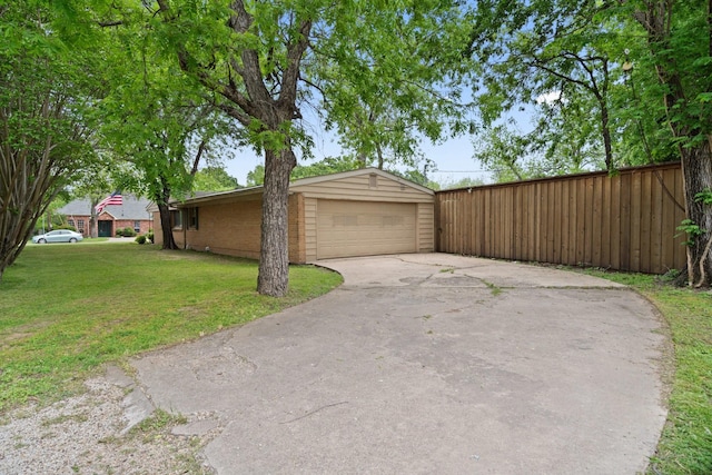 717 Van Horn Dr, Irving, TX 75060 - view of property exterior featuring a yard, a detached garage, and fence