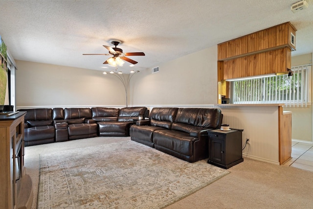 717 Van Horn Dr, Irving, TX 75060 - living area featuring light carpet, visible vents, a textured ceiling, and ceiling fan