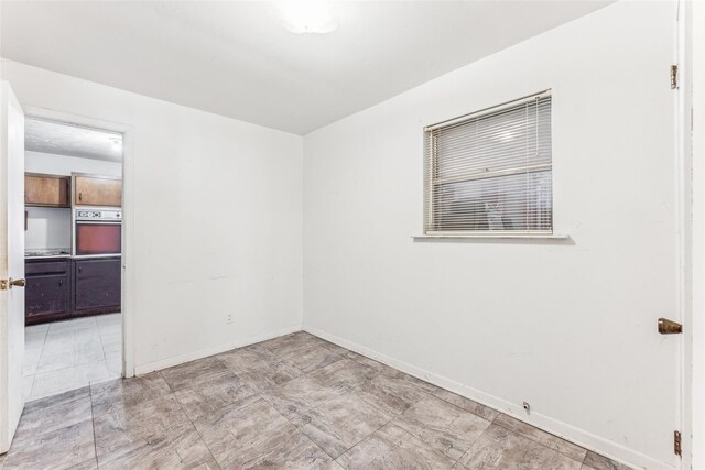 3055 Midway Rd, Grapevine, TX 76092 - spare room with baseboards