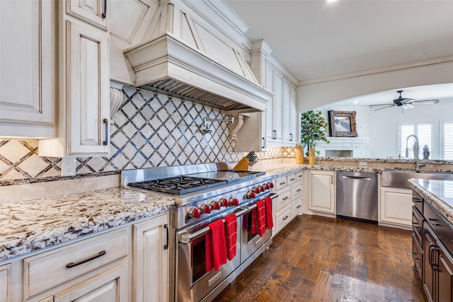 6100 Old Clarksville Rd, Reno, TX 75462 - kitchen featuring stainless steel appliances, a sink, tasteful backsplash, ceiling fan, and custom range hood