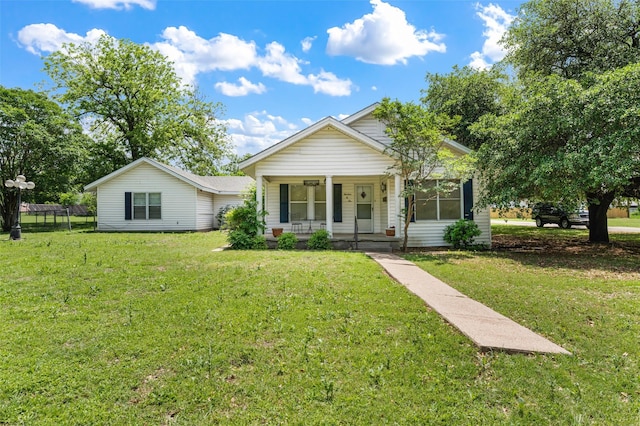 1302 E Mclennan Ave, Mart, TX 76664 - view of front of house featuring a porch and a front yard