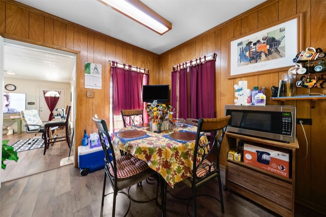 1302 E Mclennan Ave, Mart, TX 76664 - dining room featuring wooden walls and wood finished floors