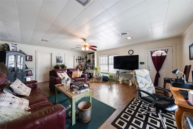 1302 E Mclennan Ave, Mart, TX 76664 - living room with ornamental molding, wood finished floors, and ceiling fan