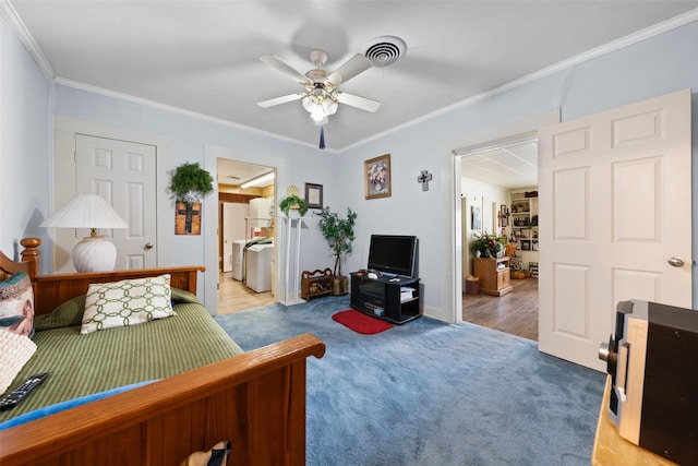 1302 E Mclennan Ave, Mart, TX 76664 - bedroom with ornamental molding, light carpet, independent washer and dryer, ceiling fan, and baseboards