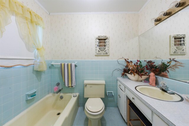 1302 E Mclennan Ave, Mart, TX 76664 - bathroom featuring wallpapered walls, tile patterned flooring, a tub, toilet, and tile walls