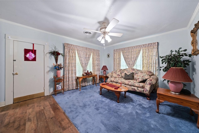 1302 E Mclennan Ave, Mart, TX 76664 - living area featuring a ceiling fan, crown molding, wood finished floors, and baseboards