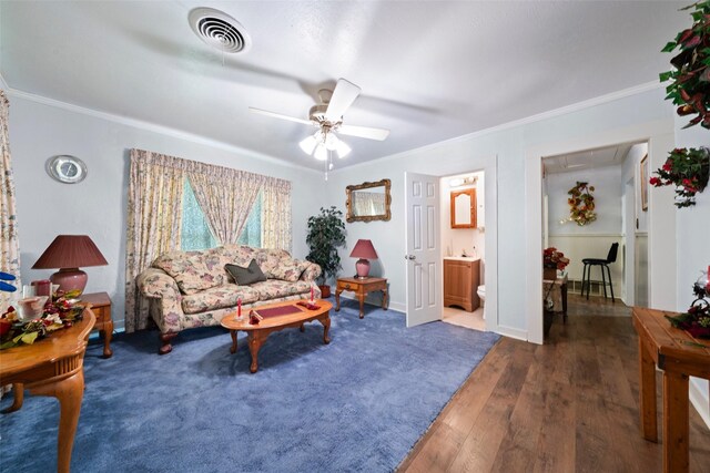 1302 E Mclennan Ave, Mart, TX 76664 - living area with hardwood / wood-style flooring, crown molding, a ceiling fan, and baseboards