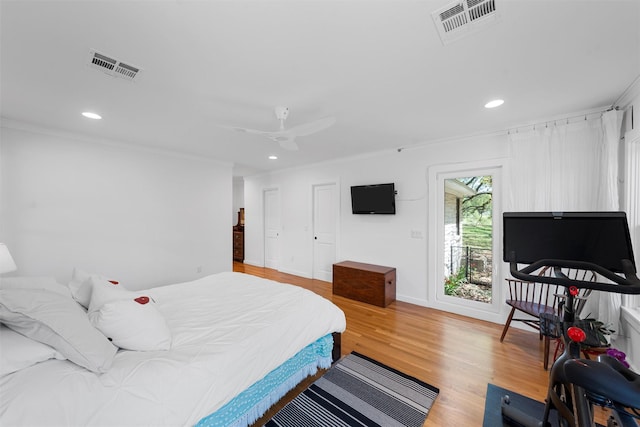 bedroom with recessed lighting, ornamental molding, light wood-type flooring, and visible vents