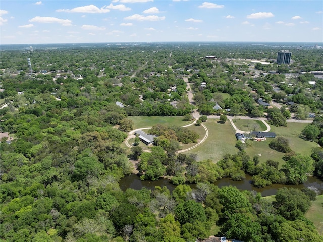 aerial view featuring a water view and a view of trees