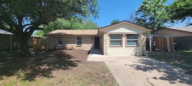 103 Lorie St, Alvarado, TX 76009 - view of front facade featuring brick siding and fence