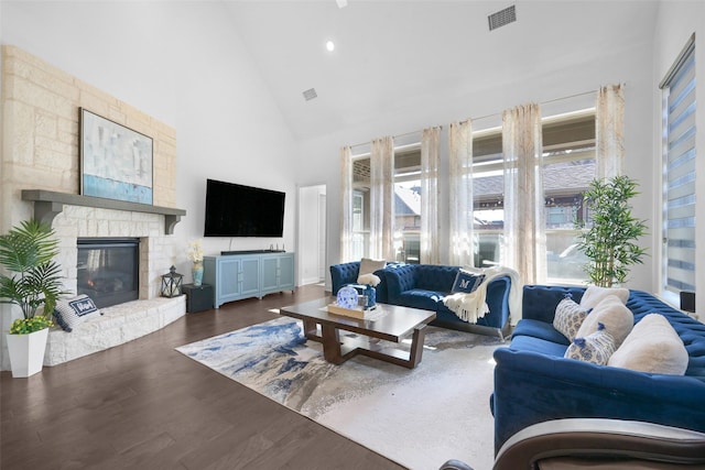 731 Drummond Dr, Prosper, TX 75078 - living area featuring high vaulted ceiling, wood finished floors, a fireplace, visible vents, and recessed lighting