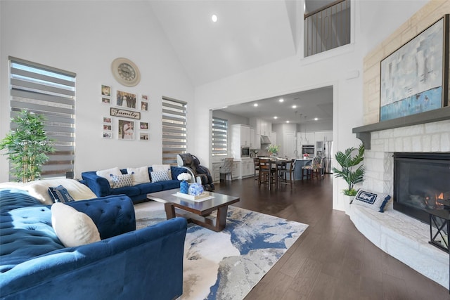 731 Drummond Dr, Prosper, TX 75078 - living area featuring recessed lighting, a fireplace, high vaulted ceiling, and dark wood-type flooring