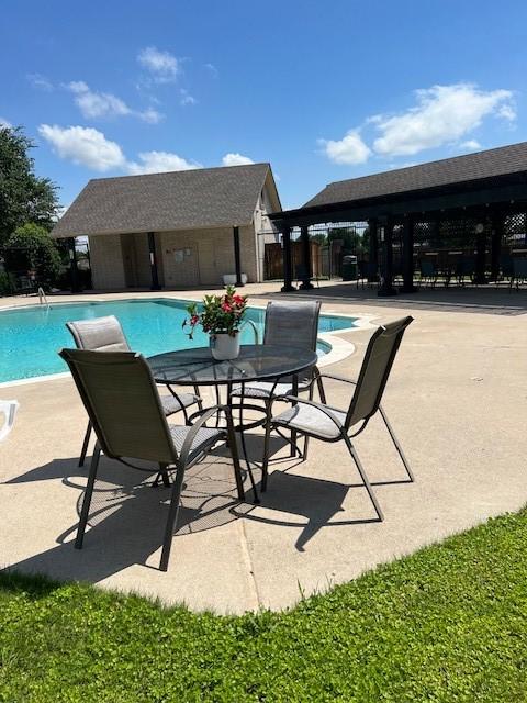 516 Hazelnut Ct, Saginaw, TX 76179 - community pool with a patio area and fence