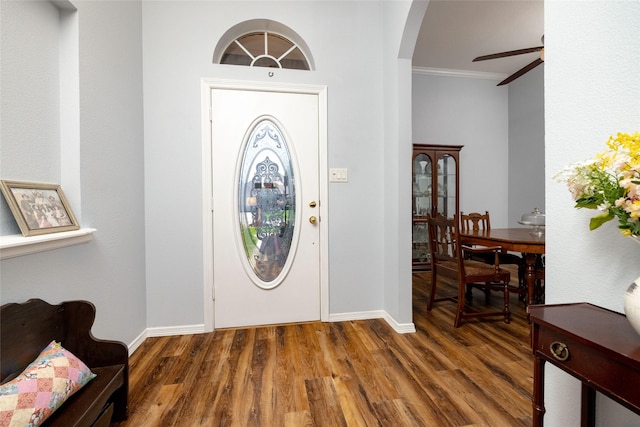 516 Hazelnut Ct, Saginaw, TX 76179 - foyer entrance featuring crown molding, arched walkways, wood finished floors, ceiling fan, and baseboards