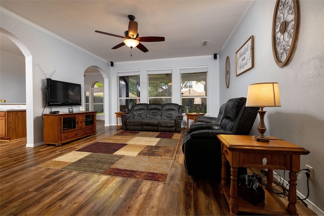 516 Hazelnut Ct, Saginaw, TX 76179 - living area featuring wood finished floors, arched walkways, ceiling fan, crown molding, and baseboards