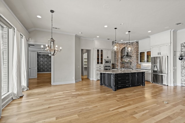 1005 Forest Lake Cir, Mckinney, TX 75072 - kitchen with stainless steel appliances, a chandelier, baseboards, light wood finished floors, and recessed lighting