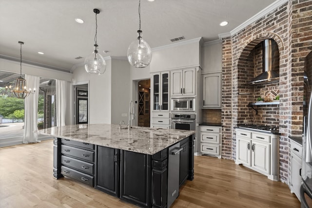 1005 Forest Lake Cir, Mckinney, TX 75072 - kitchen with a sink, wall chimney exhaust hood, ornamental molding, stainless steel appliances, and a chandelier