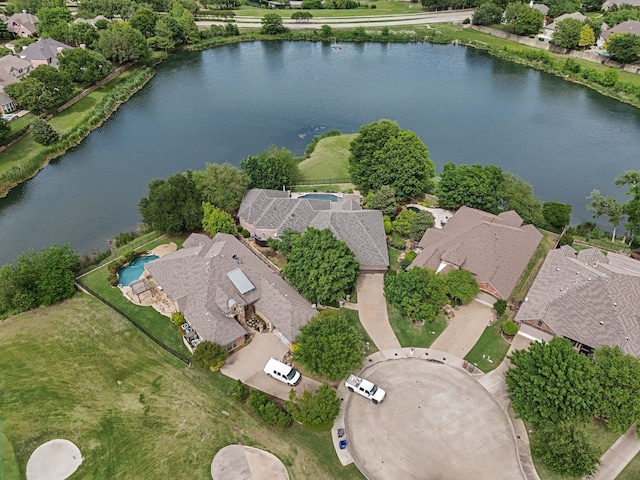 drone / aerial view featuring a water view and a residential view