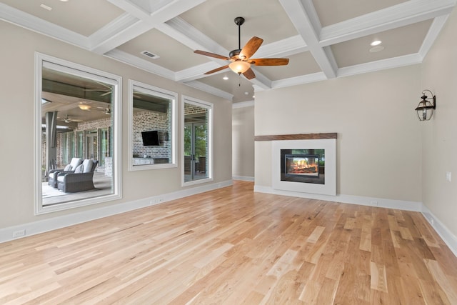 1005 Forest Lake Cir, Mckinney, TX 75072 - unfurnished living room featuring coffered ceiling, a ceiling fan, wood finished floors, a glass covered fireplace, and baseboards