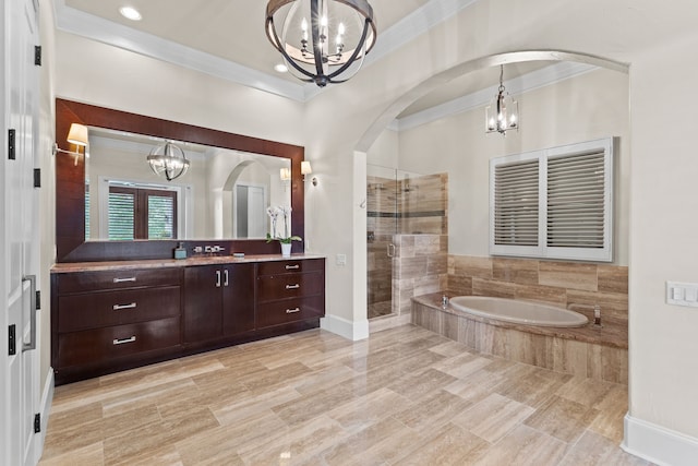1005 Forest Lake Cir, Mckinney, TX 75072 - full bath featuring a chandelier, crown molding, a shower stall, a bath, and vanity