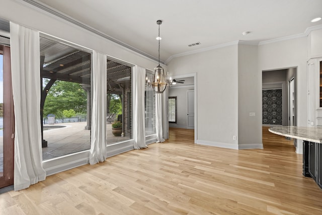 1005 Forest Lake Cir, Mckinney, TX 75072 - unfurnished dining area with ornamental molding, plenty of natural light, light wood-type flooring, a chandelier, and baseboards