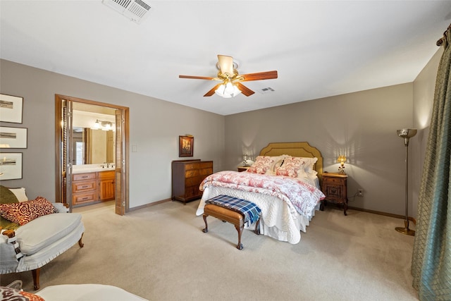 bedroom with light colored carpet, baseboards, and visible vents