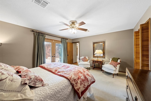 bedroom with visible vents, a ceiling fan, french doors, light colored carpet, and access to outside