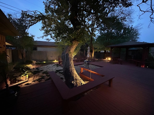 exterior space with a fenced backyard and a gazebo