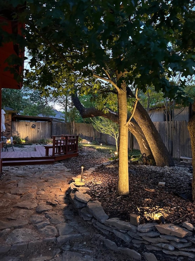view of yard with a wooden deck and fence private yard