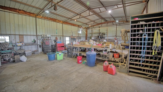 garage featuring metal wall and a workshop area