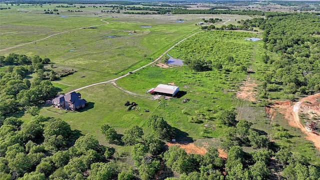 birds eye view of property with a rural view