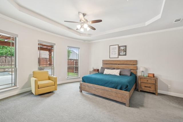 13002 Clarendon Dr, Frisco, TX 75035 - bedroom with carpet, baseboards, ornamental molding, visible vents, and a raised ceiling