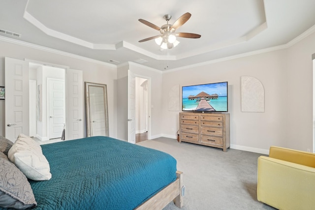 13002 Clarendon Dr, Frisco, TX 75035 - carpeted bedroom with a tray ceiling, visible vents, baseboards, and ornamental molding