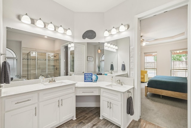 13002 Clarendon Dr, Frisco, TX 75035 - bathroom featuring a shower stall, ensuite bathroom, double vanity, and a sink