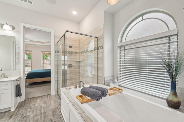 13002 Clarendon Dr, Frisco, TX 75035 - full bathroom featuring a stall shower, ensuite bathroom, visible vents, a bath, and vanity