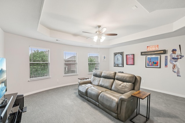 13002 Clarendon Dr, Frisco, TX 75035 - living room featuring a ceiling fan, a raised ceiling, carpet flooring, and baseboards
