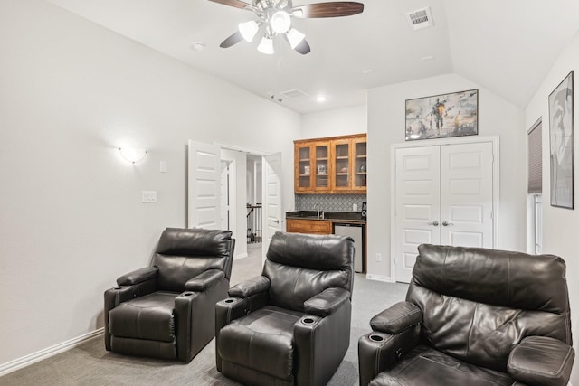 13002 Clarendon Dr, Frisco, TX 75035 - home theater featuring a ceiling fan, a sink, visible vents, light colored carpet, and wet bar