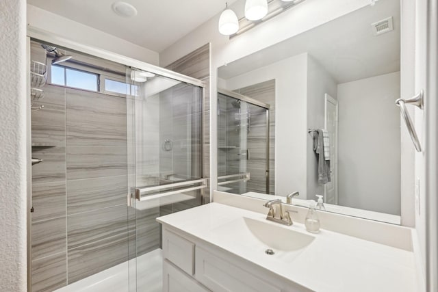 13002 Clarendon Dr, Frisco, TX 75035 - bathroom featuring a shower stall, vanity, and visible vents