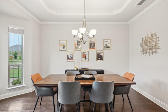13002 Clarendon Dr, Frisco, TX 75035 - dining space with a tray ceiling, a notable chandelier, dark wood-style floors, and baseboards
