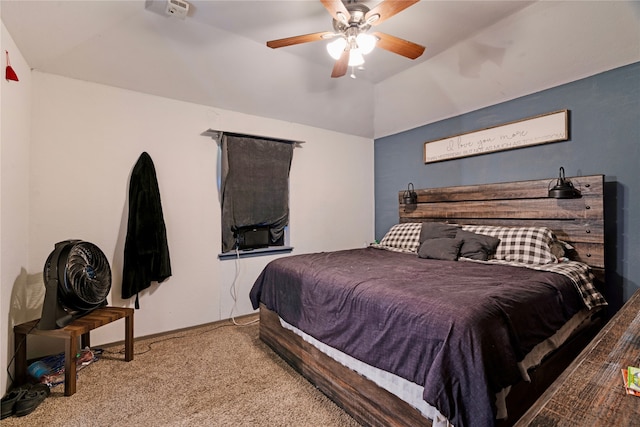 carpeted bedroom featuring vaulted ceiling and ceiling fan
