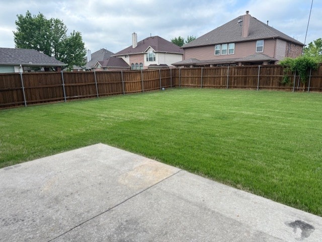 view of yard featuring a patio and a fenced backyard