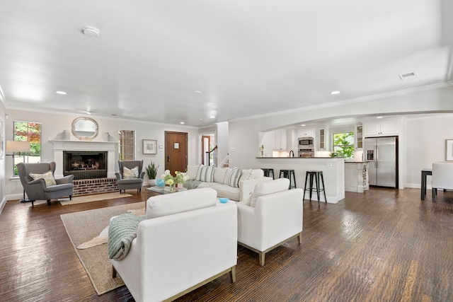 6726 Williamson Rd, Dallas, TX 75214 - living area featuring recessed lighting, crown molding, a fireplace, dark wood-style floors, and baseboards
