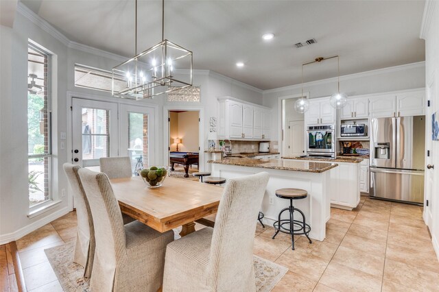 dining room with recessed lighting, ornamental molding, visible vents, and light tile patterned floors